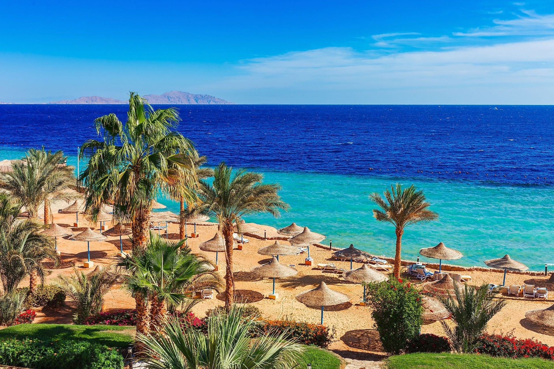 Family enjoying Red Sea holiday on Hurghada beach, Egypt